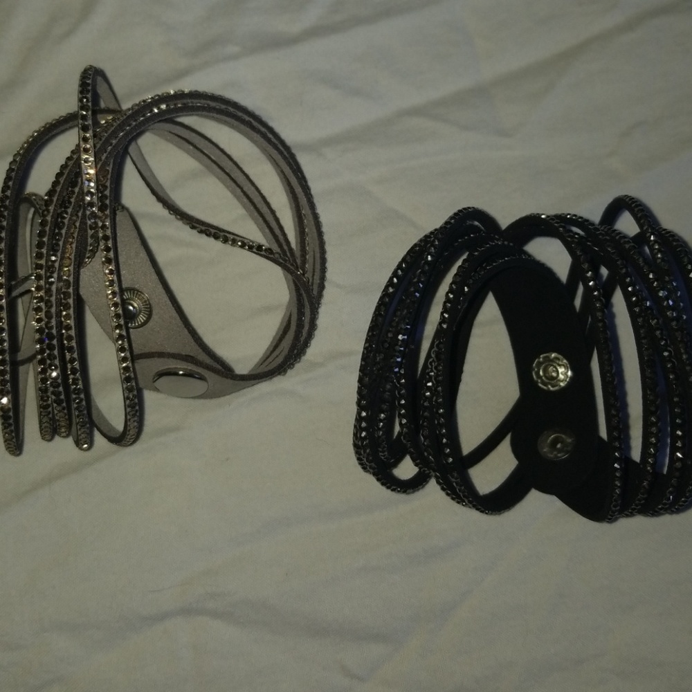 Pair of wrap bracelets. One gray. One black.